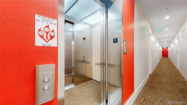 a view of a lush green hillside and houses