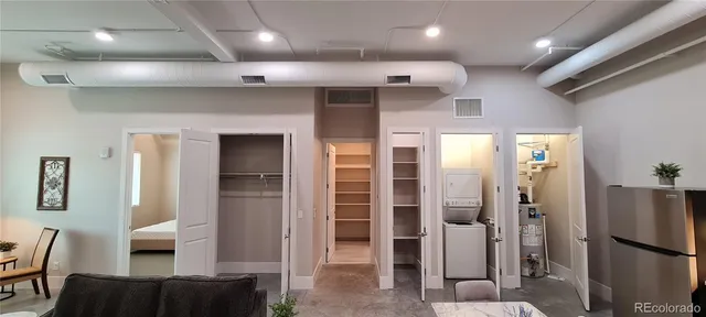 a bed room with a bed and a dresser