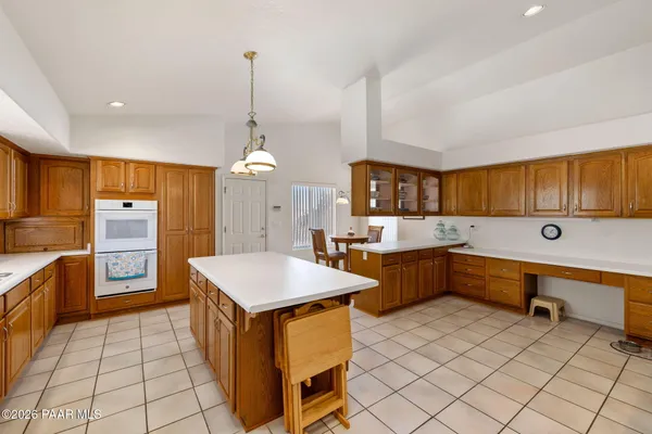 a kitchen with a cabinets and appliances