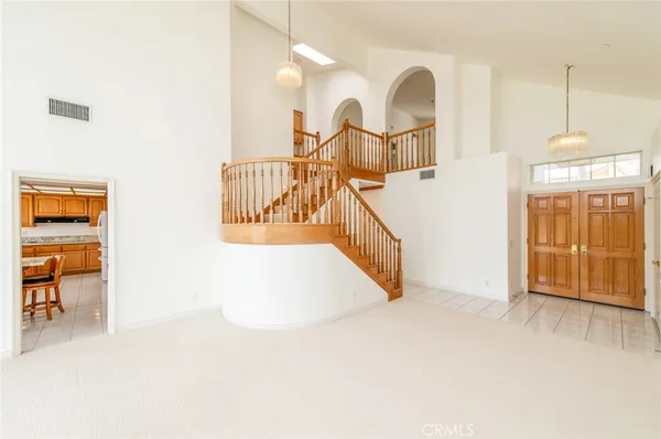 a view of a livingroom with furniture and staircase