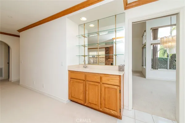 a bathroom with a shower sink and mirror