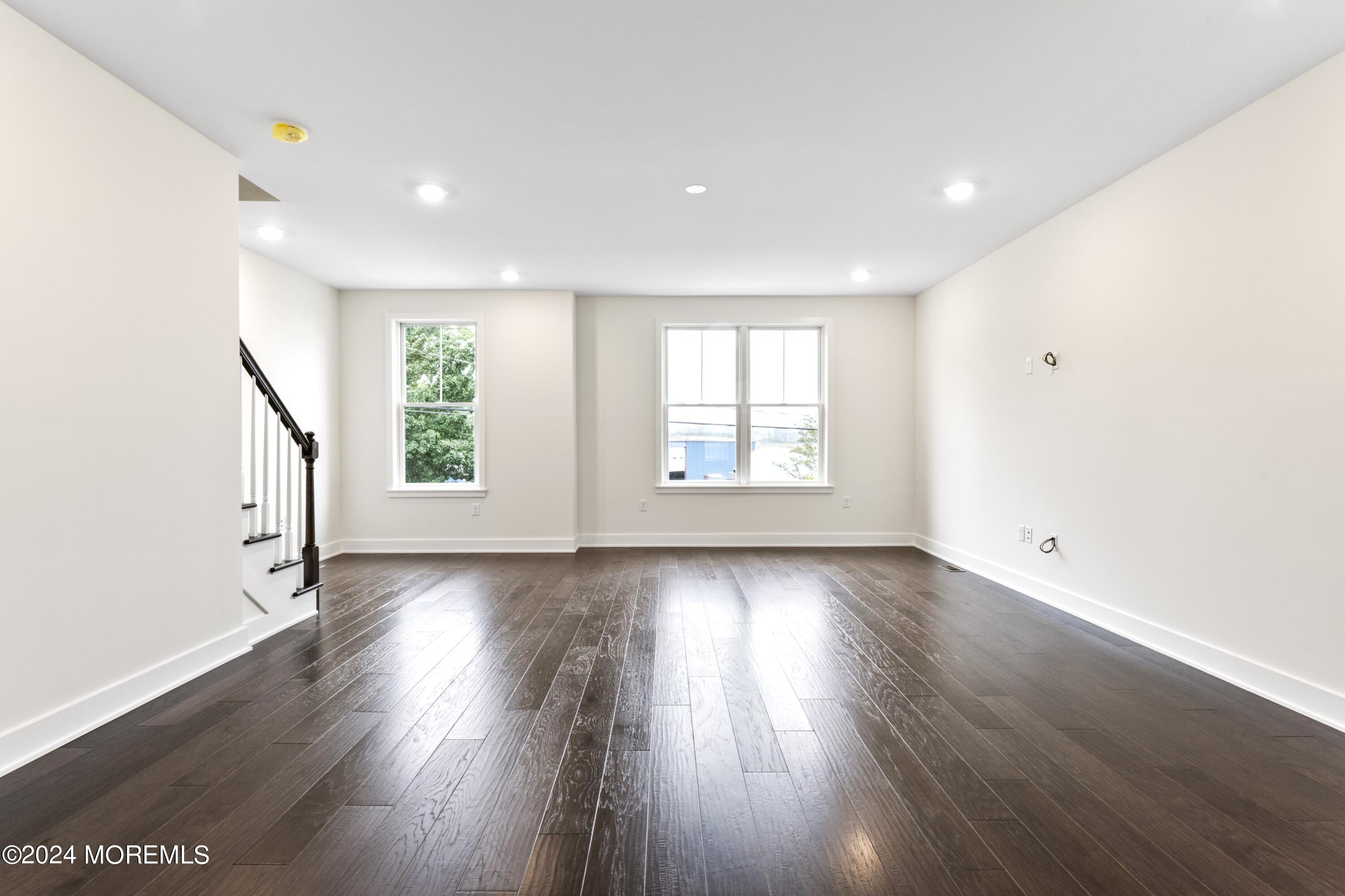 25 Raritan Cove Keyport, NJ 07735 - Photo 10 of 50 an empty room with wooden floor and windows