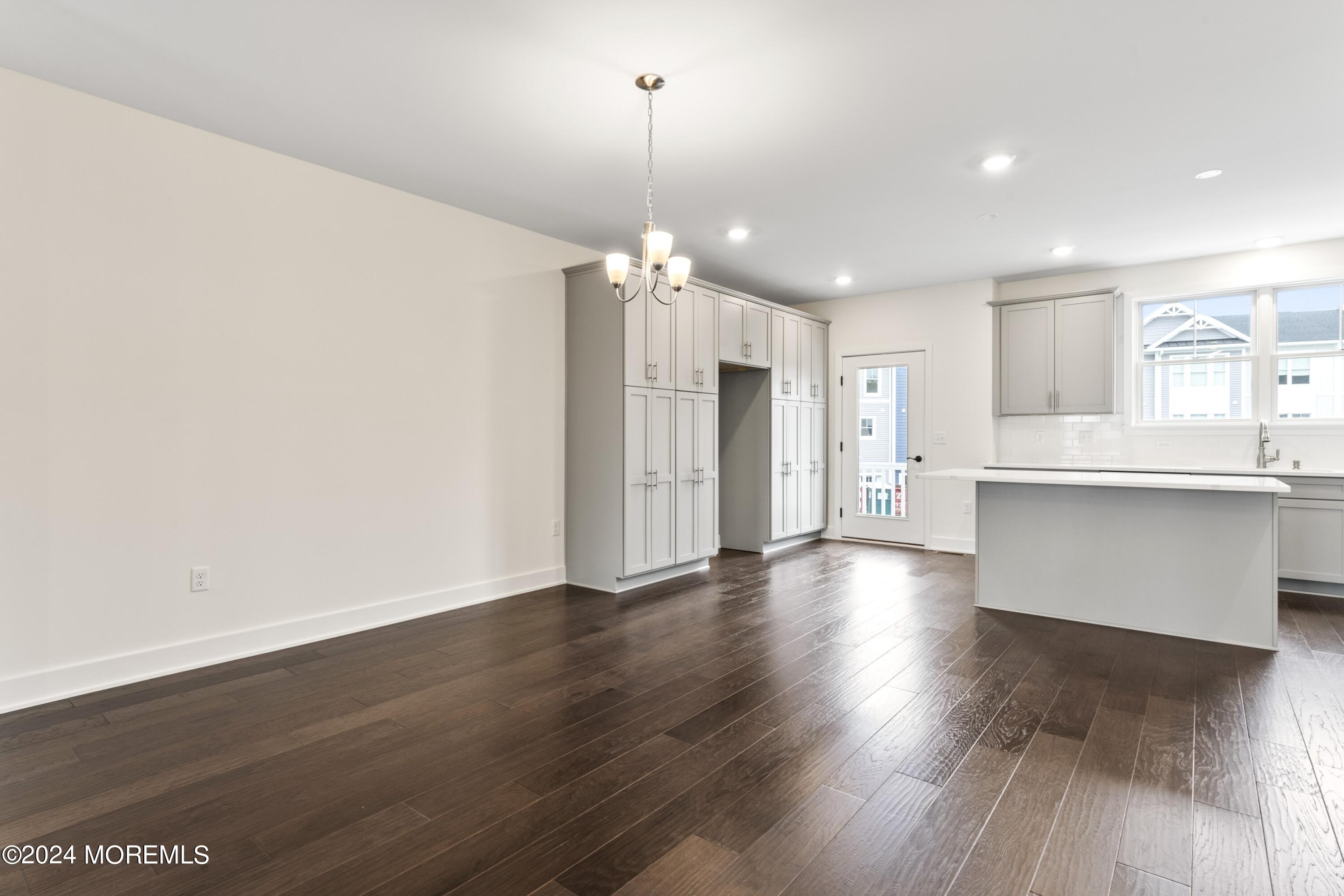 25 Raritan Cove Keyport, NJ 07735 - Photo 13 of 50 a view of a kitchen with wooden floor and a kitchen