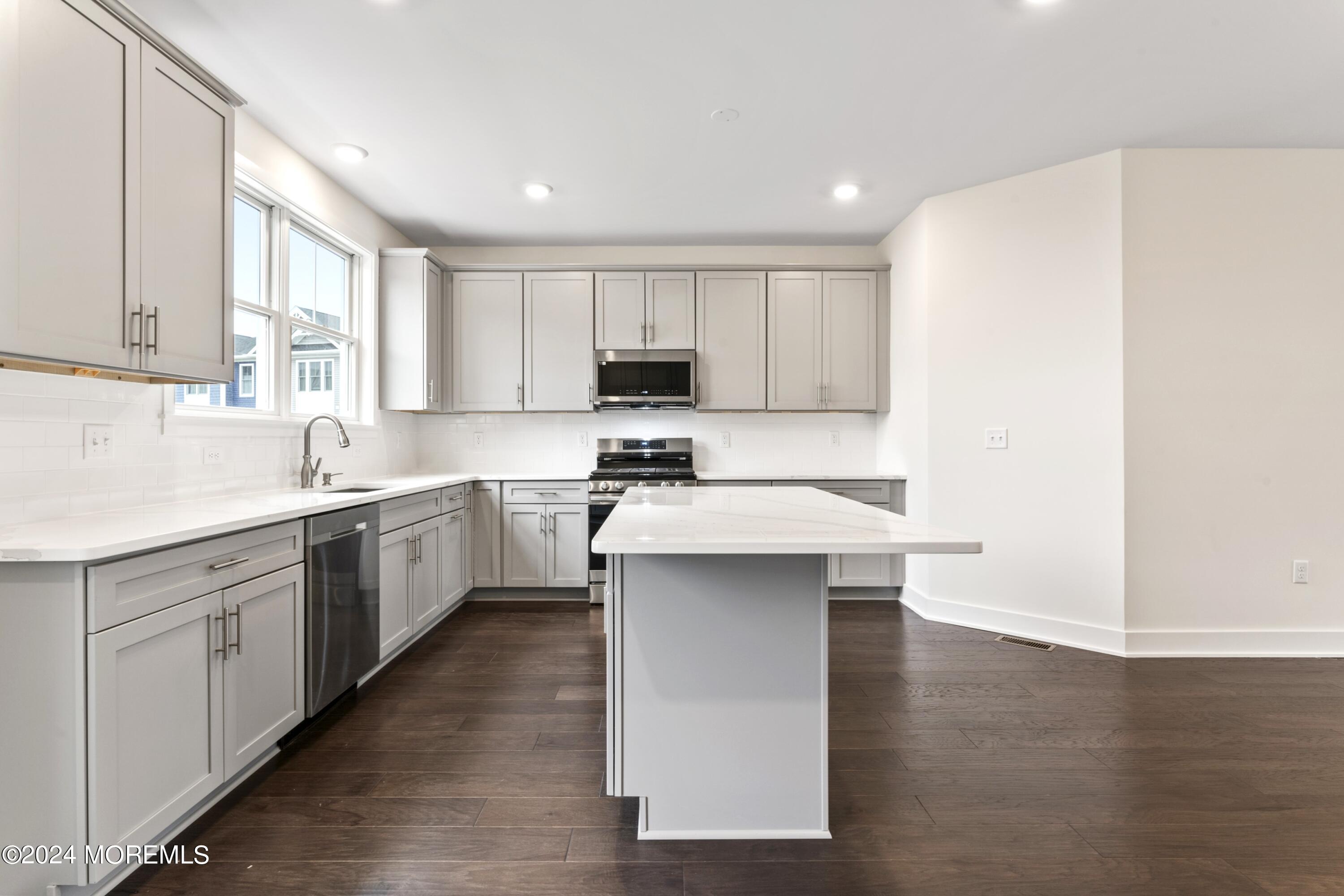 25 Raritan Cove Keyport, NJ 07735 - Photo 17 of 50 a kitchen with a sink a window and stainless steel appliances