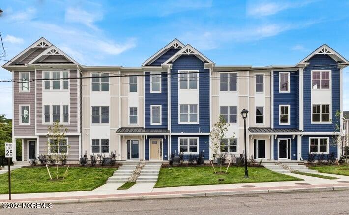 25 Raritan Cove Keyport, NJ 07735 - Photo 2 of 50 a front view of a building with a yard