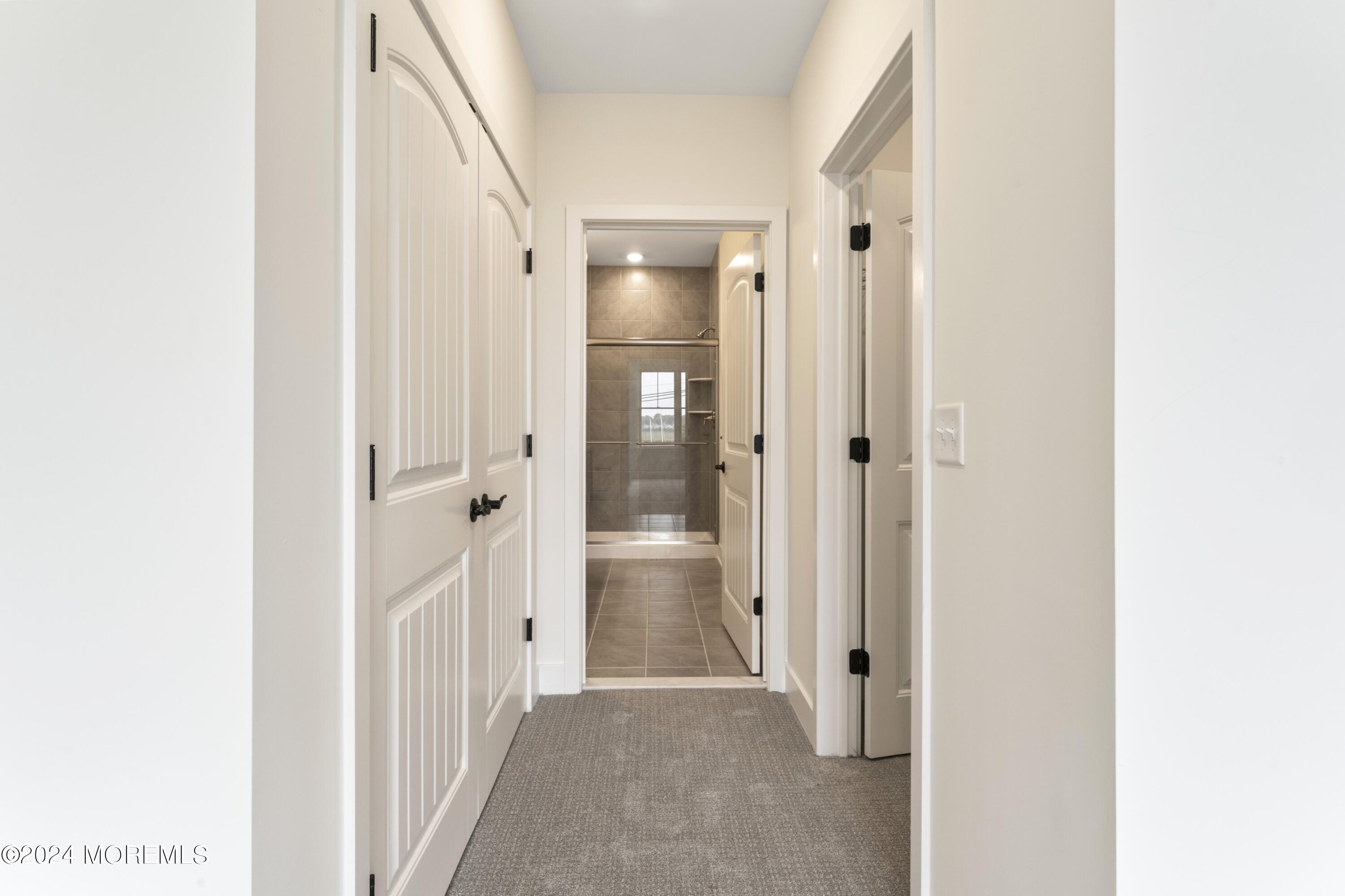 25 Raritan Cove Keyport, NJ 07735 - Photo 24 of 50 a view of a hallway with wooden shelves