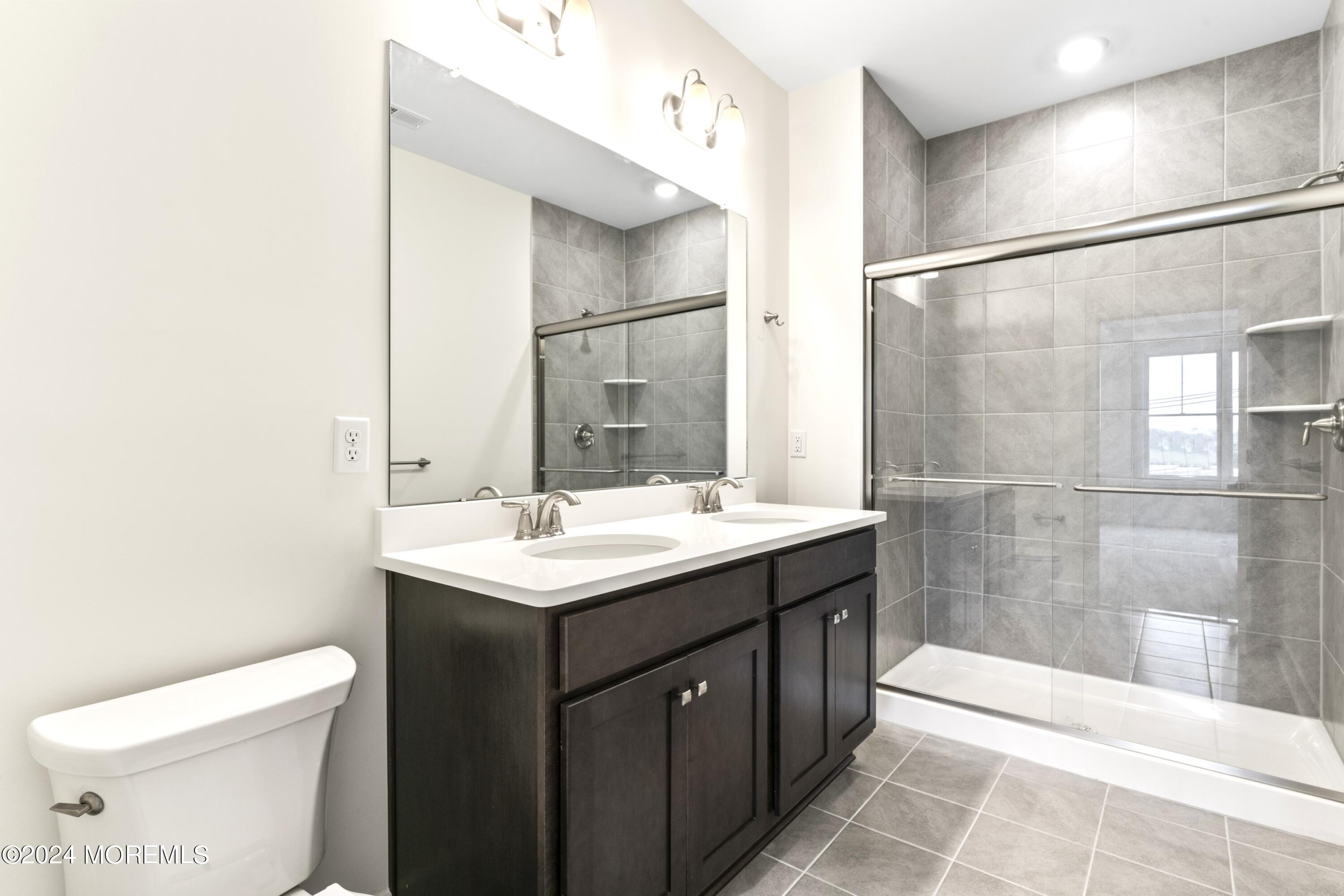 25 Raritan Cove Keyport, NJ 07735 - Photo 26 of 50 a bathroom with a sink toilet and shower