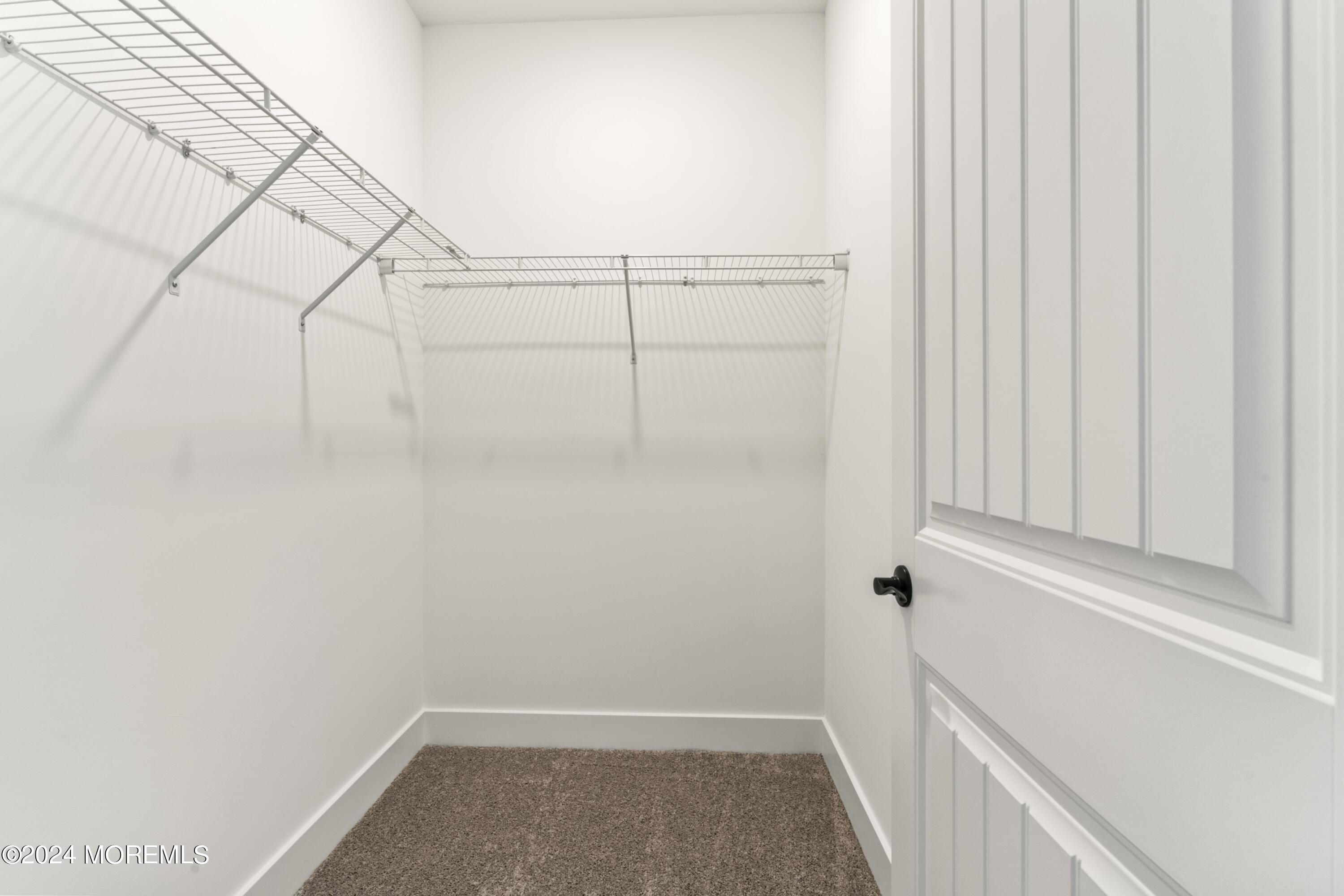 25 Raritan Cove Keyport, NJ 07735 - Photo 30 of 50 a view of a room with racks on the wall