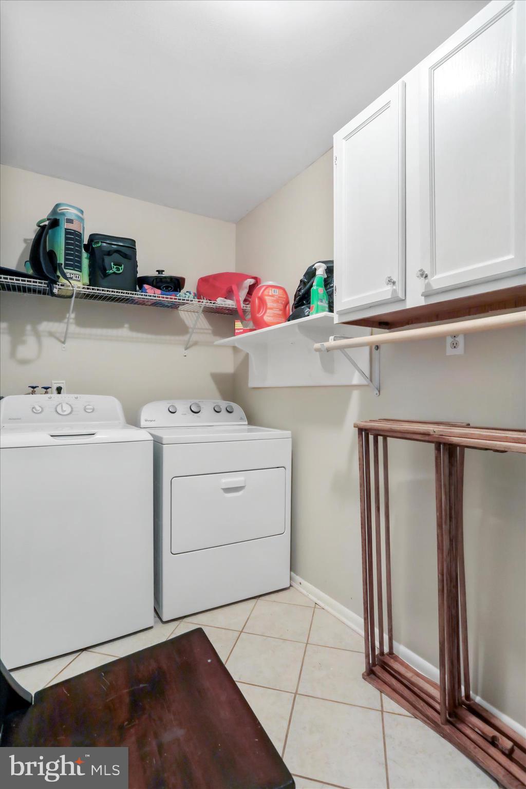 4381 Engle Molers Road Shepherdstown, WV 25443 - Photo 13 of 42 Laundry with storage and shelves