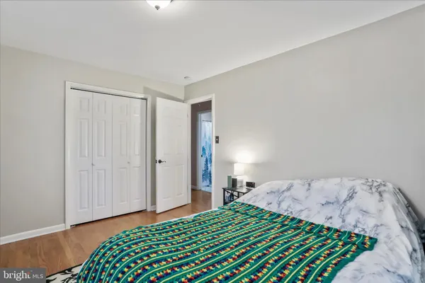 a bedroom with a bed and a lamp