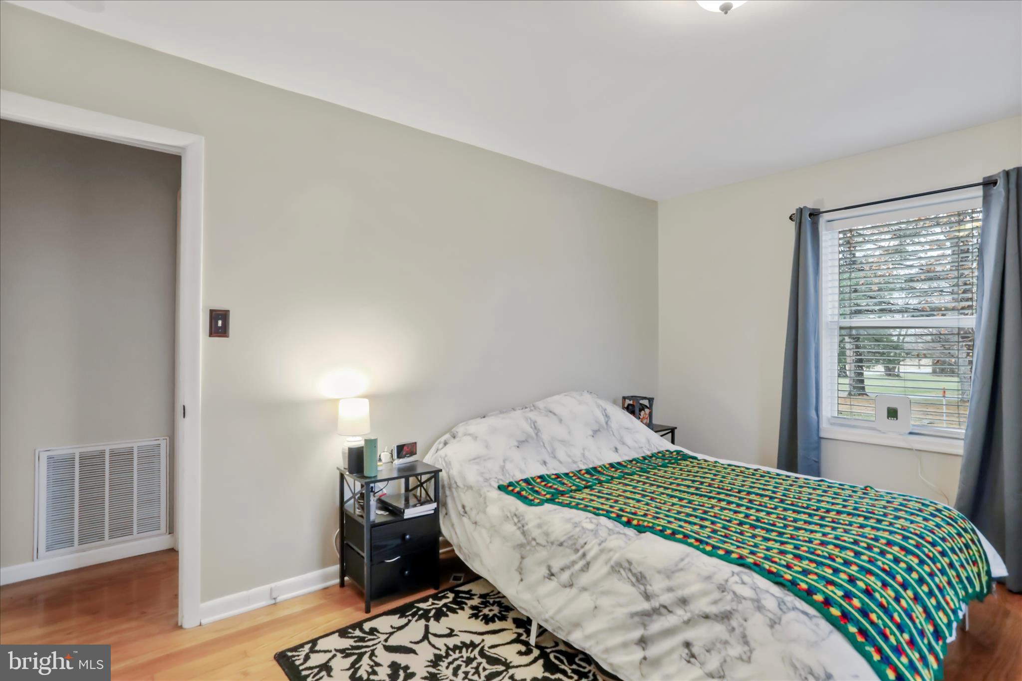 4381 Engle Molers Road Shepherdstown, WV 25443 - Photo 22 of 44 a bedroom with a bed and wooden floor