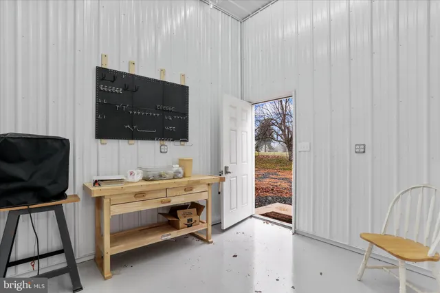 a room that has a bed and a chair in it