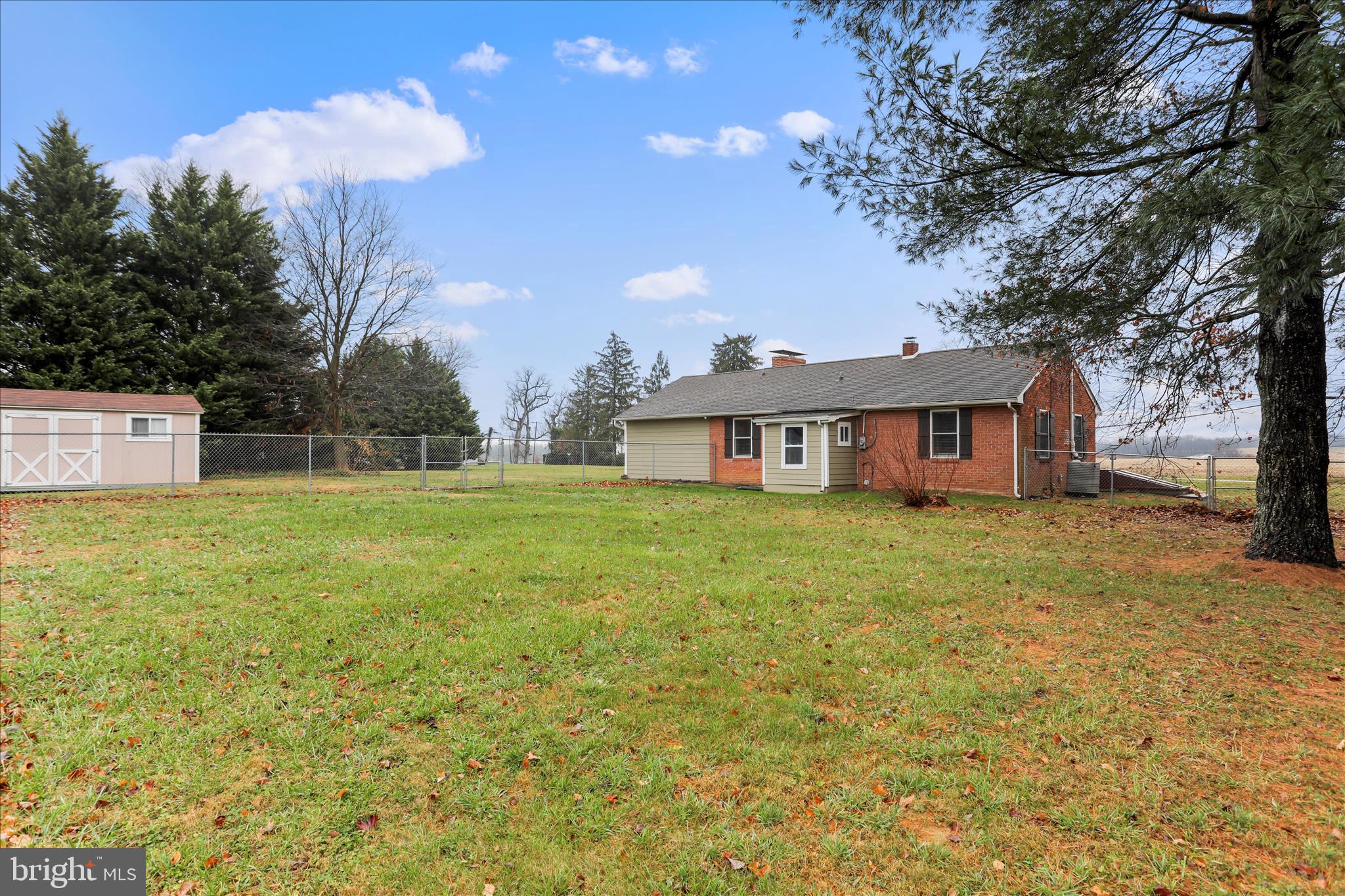 4381 Engle Molers Road Shepherdstown, WV 25443 - Photo 31 of 42 Rear of home with chain link fence