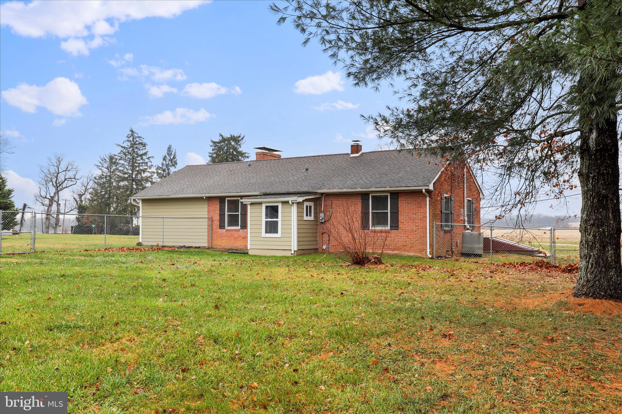4381 Engle Molers Road Shepherdstown, WV 25443 - Photo 33 of 44 a house that is sitting in the grass with large trees