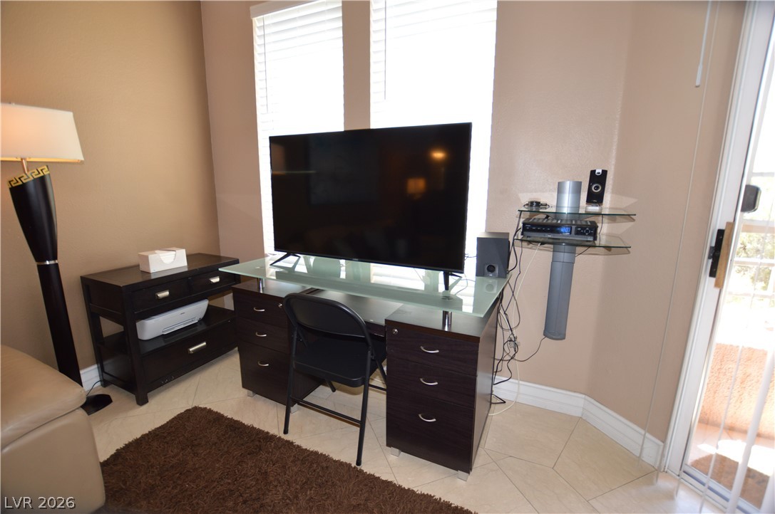 220 East Flamingo Road, Unit 327 Las Vegas, NV 89169 - Photo 11 of 13 A dedicated home office space with ample natural illumination, perfect for productivity.