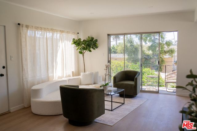a view of a dining room with furniture and a window
