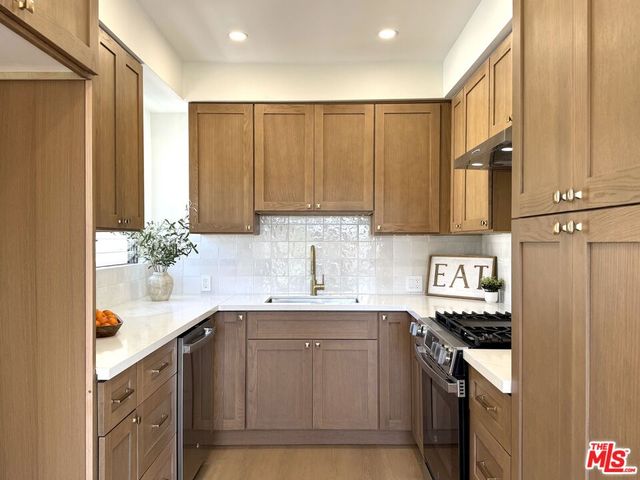 a bathroom with a sink a toilet and bathtub