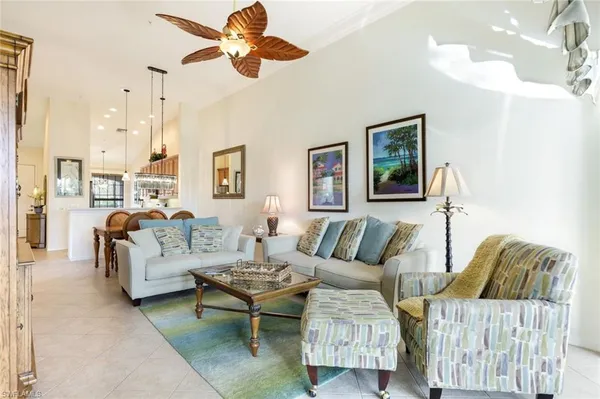 a living room with furniture and a rug