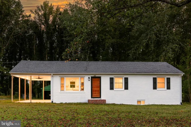 front view of a house with a yard