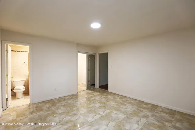 a view of an empty room and a gallery