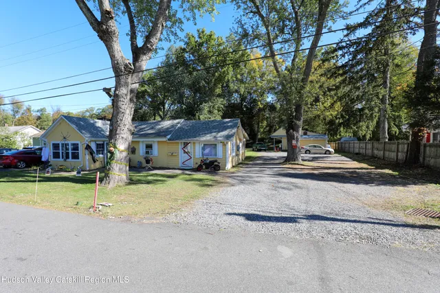 a view of house with outdoor space and street view