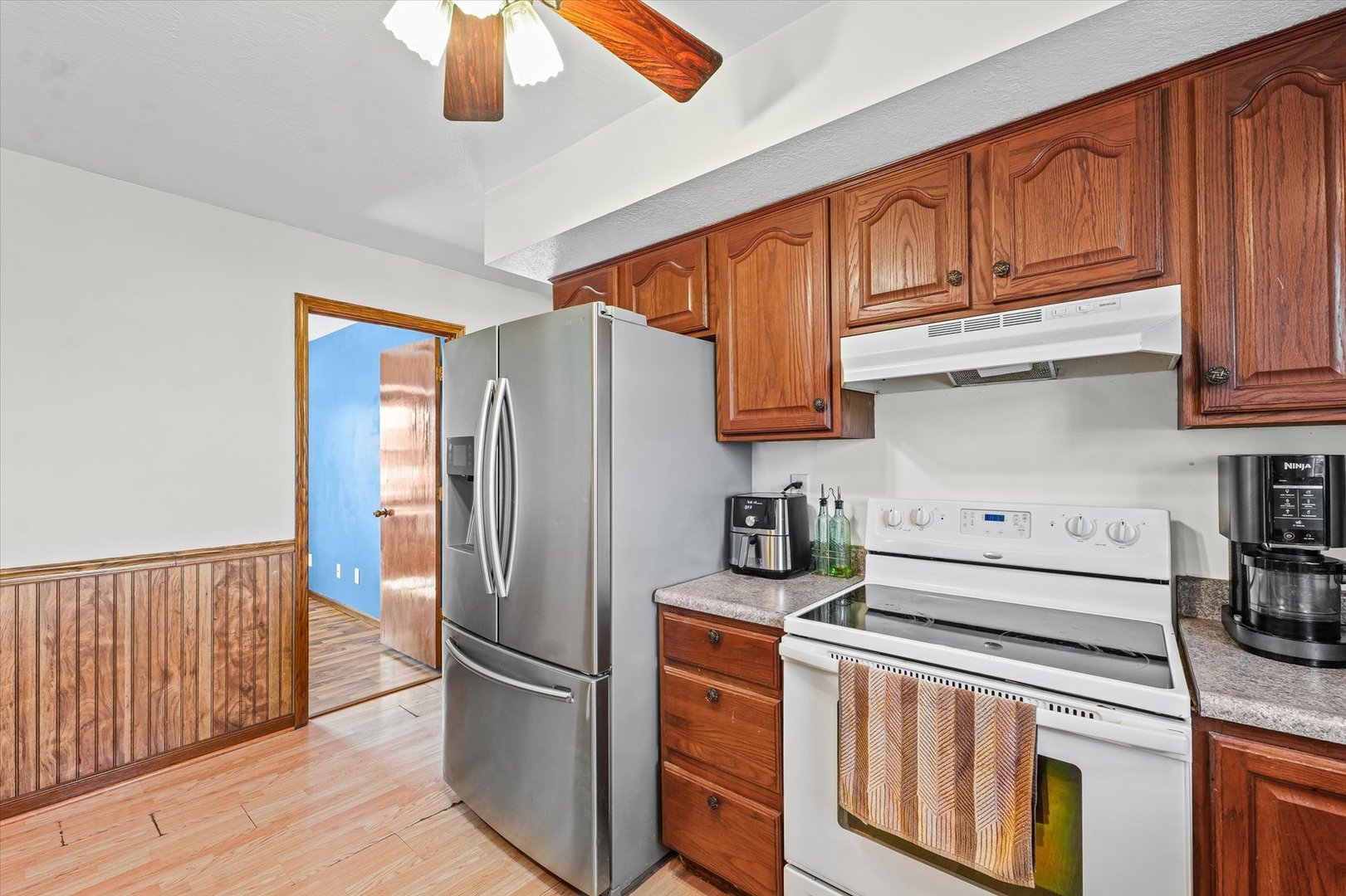29 Falcon Pass Camargo, IL 61919 - Photo 12 of 27 a kitchen with stainless steel appliances granite countertop a refrigerator sink and cabinets