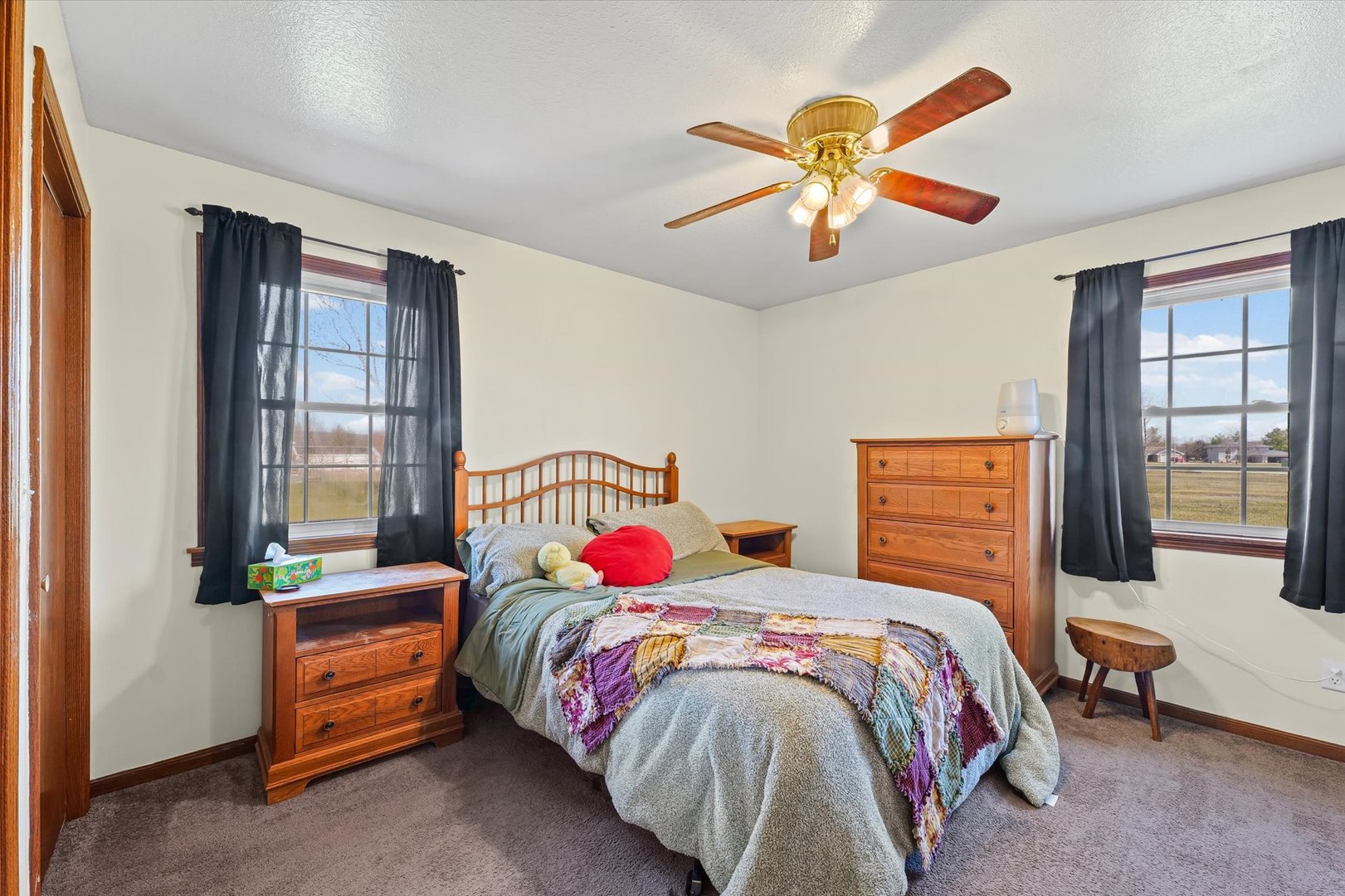 29 Falcon Pass Camargo, IL 61919 - Photo 14 of 27 a bedroom with a bed and a chandelier