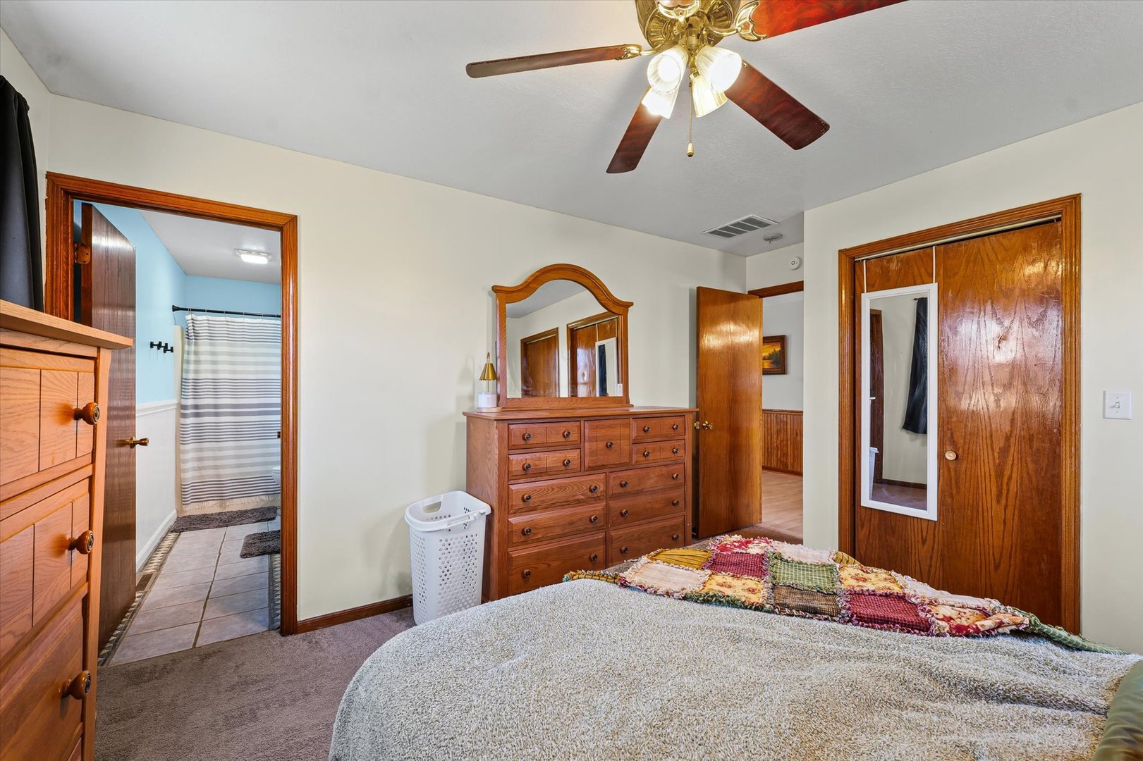 29 Falcon Pass Camargo, IL 61919 - Photo 15 of 27 a bedroom with a bed and a chandelier