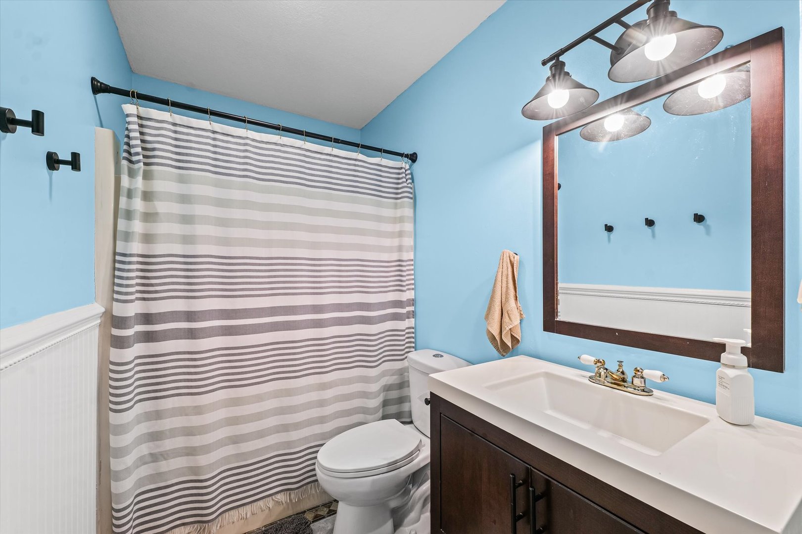 29 Falcon Pass Camargo, IL 61919 - Photo 16 of 27 a bathroom with a sink a toilet a mirror and shower curtain