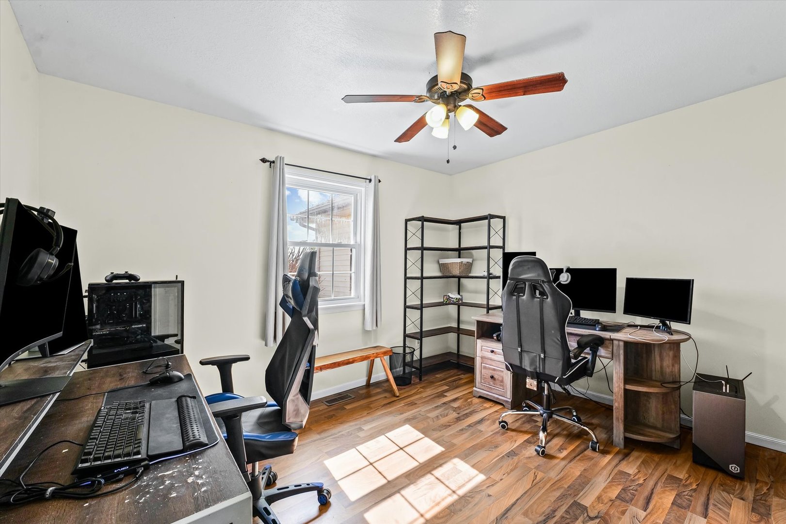 29 Falcon Pass Camargo, IL 61919 - Photo 19 of 27 a view of a workspace with furniture and a ceiling fan