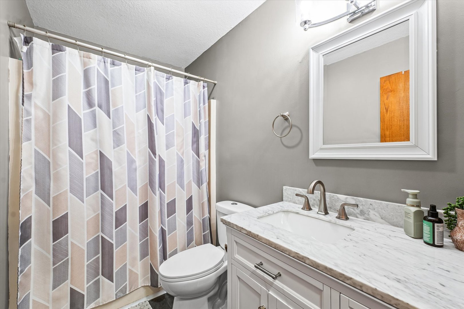 29 Falcon Pass Camargo, IL 61919 - Photo 21 of 27 a bathroom with a granite countertop sink a toilet and a mirror