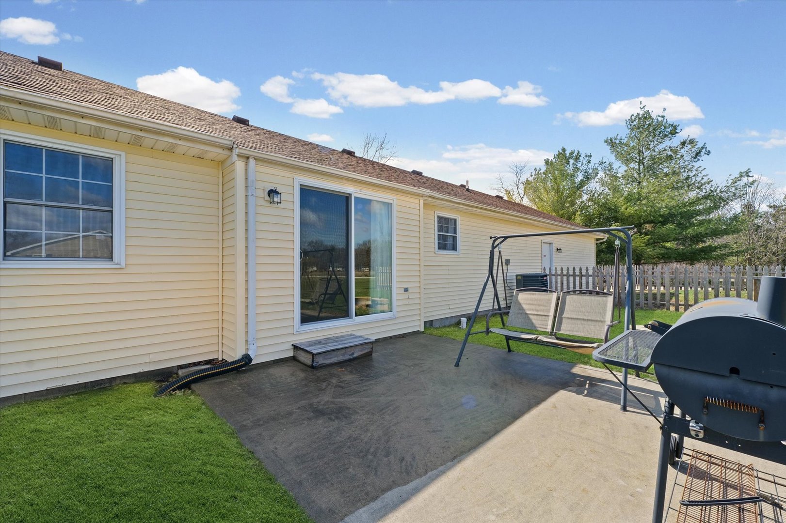 29 Falcon Pass Camargo, IL 61919 - Photo 24 of 27 a view of backyard with chair and iron fence