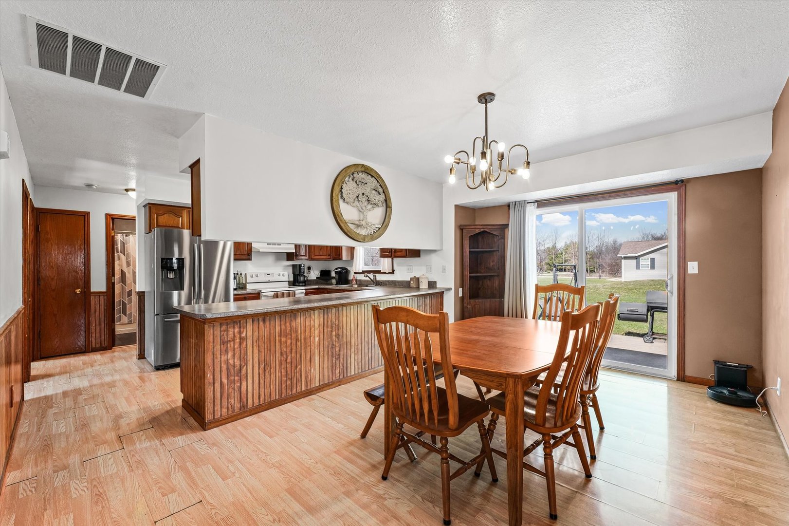 29 Falcon Pass Camargo, IL 61919 - Photo 9 of 27 a dining room with a wooden table and chairs