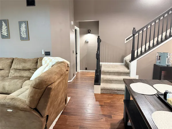 a living room with furniture and a table