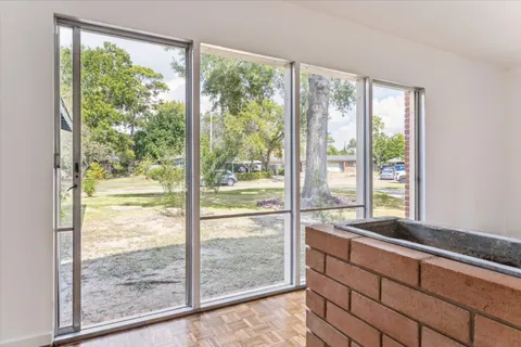 a view of a room that has a large window
