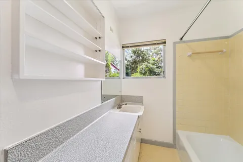 a bathroom with a bathtub and a sink