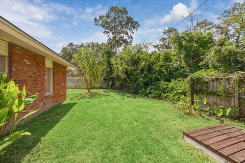 a backyard of a house with lots of green space