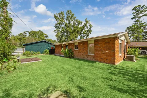 a view of a backyard with potted plants