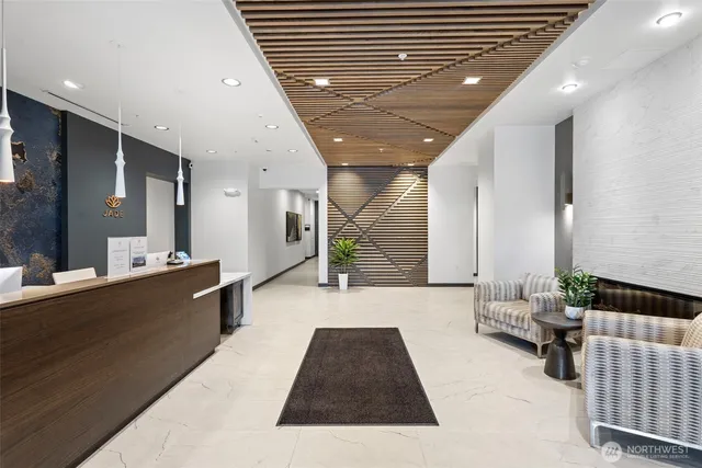 a kitchen with refrigerator and chairs