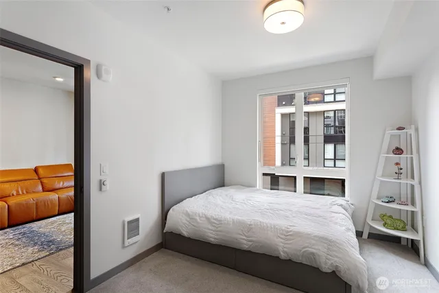 a bedroom with a bed and a view of bedroom