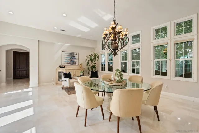 a open dining room with kitchen island stainless steel appliances furniture stove and kitchen view