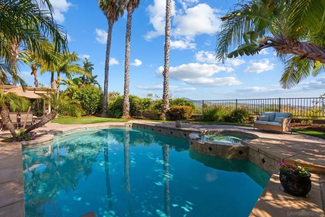 a view of a swimming pool with a patio