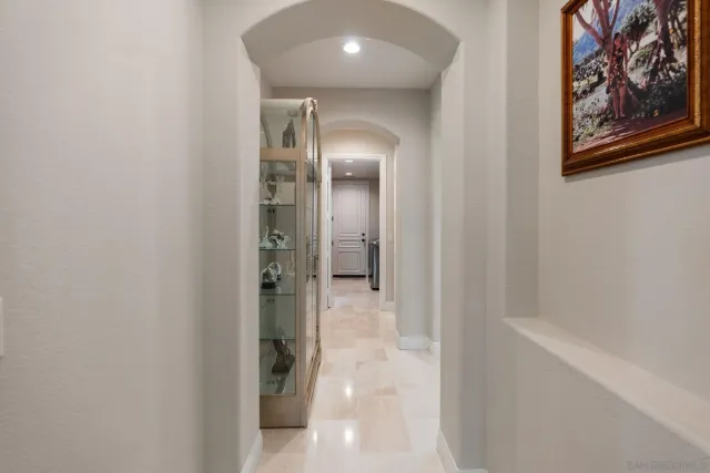 a spacious bathroom with a granite countertop sink a mirror and a shower