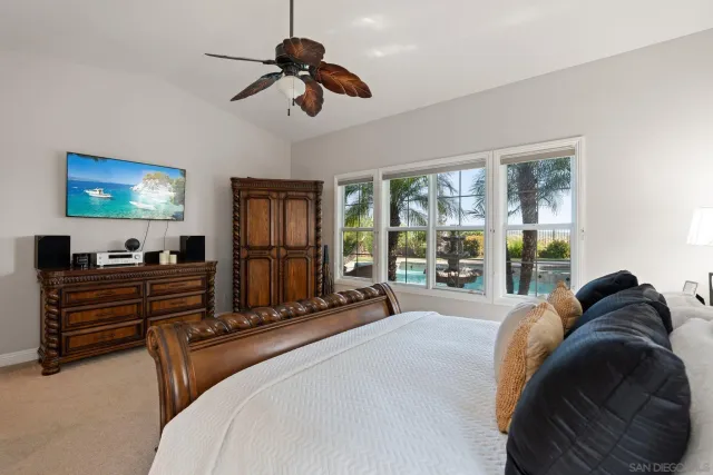 a bathroom with a tub a sink and a window