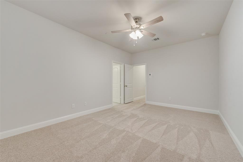 7853 Sunset Boulevard Rowlett, TX 75088 - Photo 12 of 31 a view of an empty room with chandelier fan