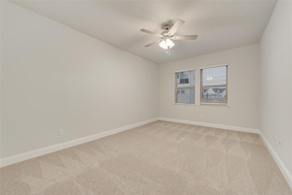 7853 Sunset Boulevard Rowlett, TX 75088 - Photo 13 of 31 a view of an empty room with a fan