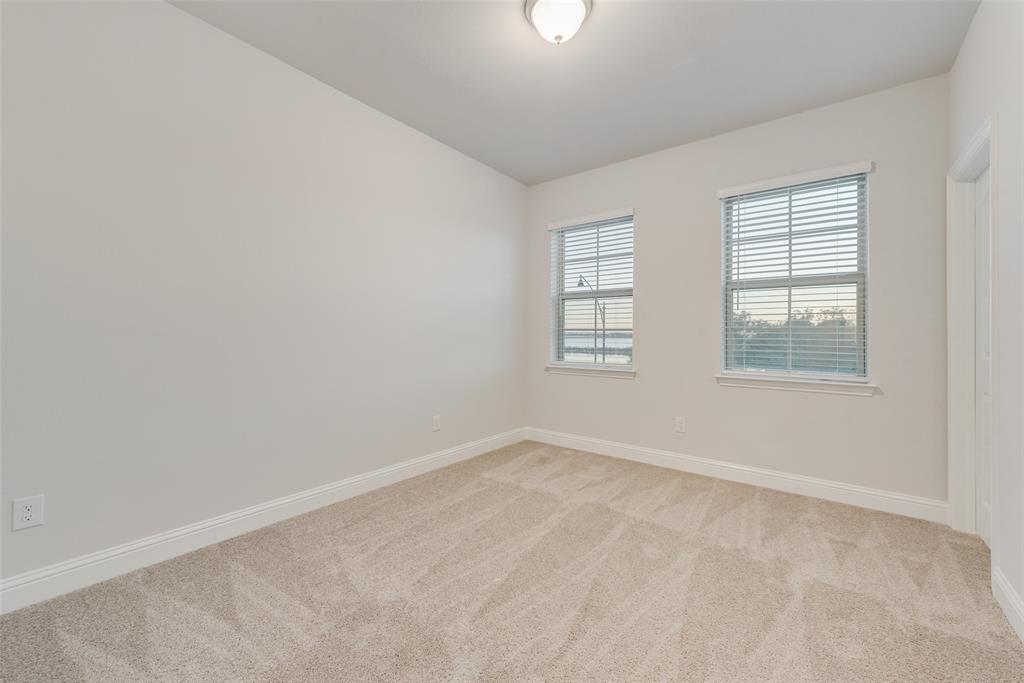 7853 Sunset Boulevard Rowlett, TX 75088 - Photo 18 of 31 an empty room with windows