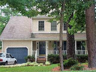 4409 Pleasant Grove Church Road Raleigh, NC 27613 - Photo 1 of 1 a view of a house with a yard and plants