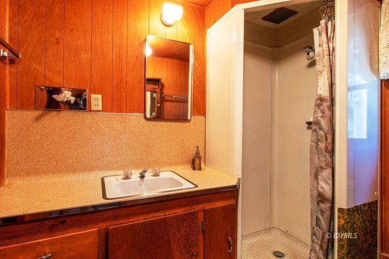 27401 Saunders Meadow Road Idyllwild, CA 92549 - Photo 19 of 37 a bathroom with a sink and a mirror