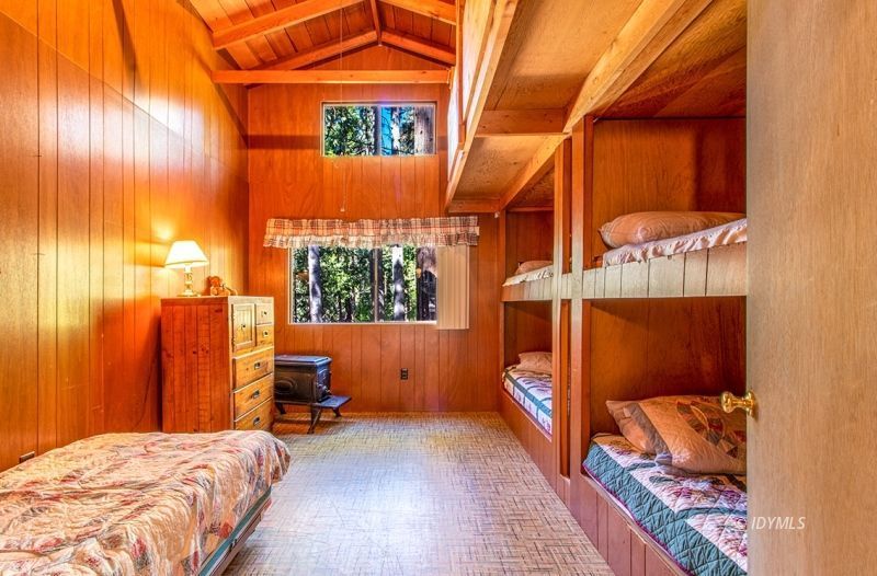 27401 Saunders Meadow Road Idyllwild, CA 92549 - Photo 20 of 37 a bedroom with a bed and a window